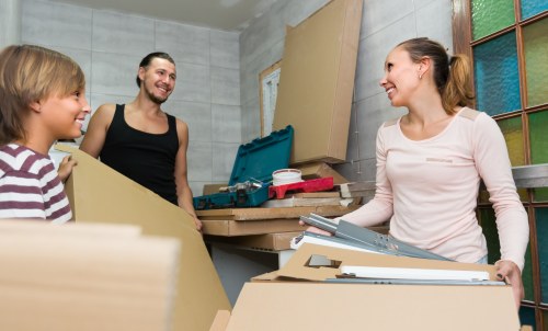 Movers dismantling office furniture for a Maidahill relocation