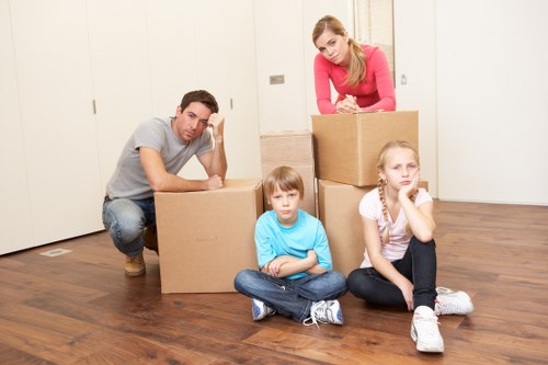 Packed moving boxes and furniture ready for transport