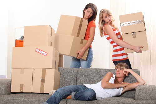 Professional removals team loading items for a Maidahill move