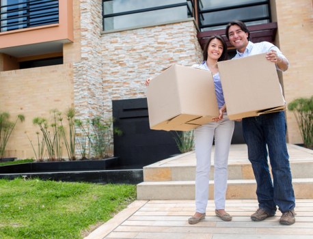 Moving boxes and office items ready for a Maidahill relocation
